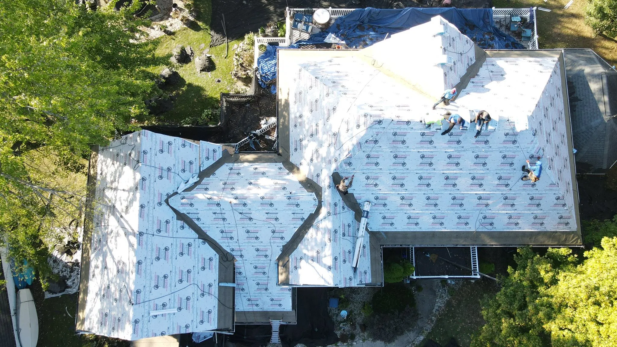Synthetic underlayment going down before the new shingles
